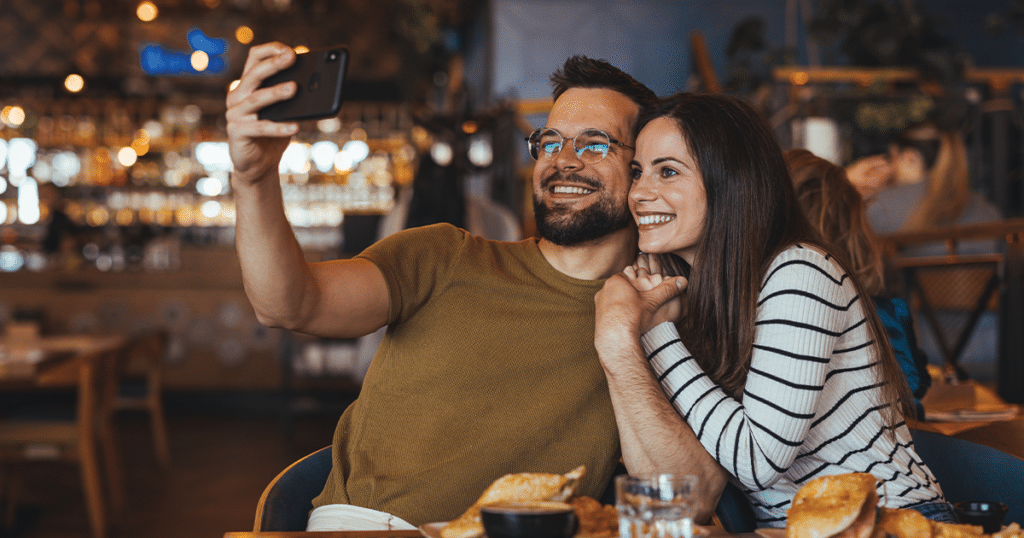 A couple taking a selfie.